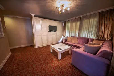 a living room with a couch and a table at Dream Hill Business Deluxe Hotel Asia in Istanbul