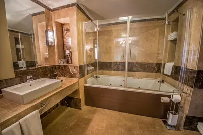 a bathroom with a tub and a sink and a shower at Dream Hill Business Deluxe Hotel Asia in Istanbul