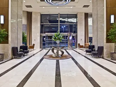 a lobby with a fountain in the middle of a building at Ramada Plaza By Wyndham Istanbul Tekstilkent in Istanbul