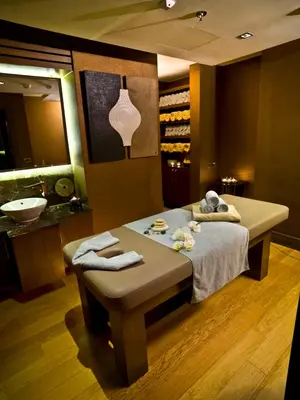a room with a bed and a sink in a bathroom at Ramada Plaza By Wyndham Istanbul Tekstilkent in Istanbul