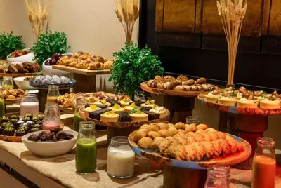 a buffet of different types of food on a table at Ramada Plaza By Wyndham Istanbul Tekstilkent in Istanbul