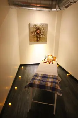 a room with a table with candles and a painting at Grand Washington Hotel in Istanbul
