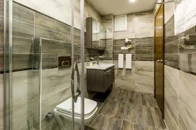 a bathroom with a toilet and a sink at Golden Crown Hotel in Istanbul