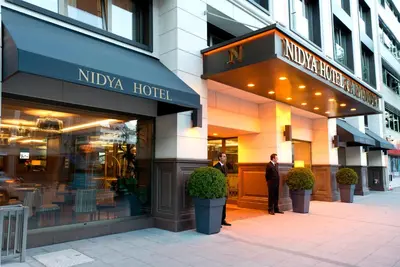 a man is standing outside of a hotel at Nidya Hotel Galataport in Istanbul