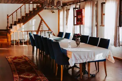 a dining room with a long table and chairs at Misgibi Hotel in Bursa