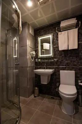 a bathroom with a toilet and a sink and a shower at Avrasya Port Hotel in Istanbul