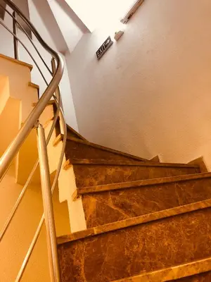 a set of stairs with a sign on the wall at Beyhan Hotel in Istanbul
