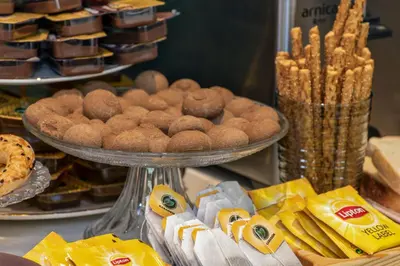 a table with a plate of pastries and other foods at Nika otel & cafe in Istanbul