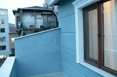 a blue wall of a building with a window at Sare House in Istanbul