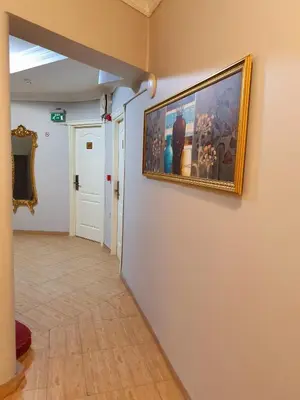 a hallway with a painting on the wall at Şehir Hotel Old City in Istanbul
