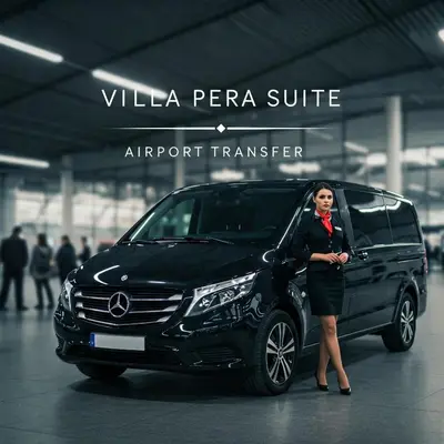a woman standing in front of a black car at Villa Pera Suite Hotel in Istanbul