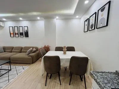 a living room with a table and a couch at Westley Residence Taksim in Istanbul
