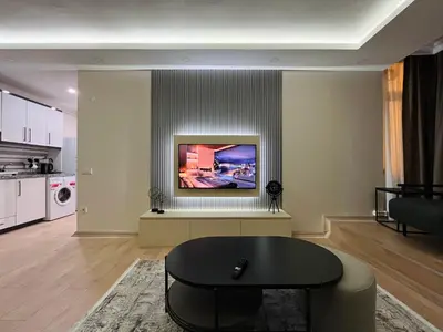 a living room with a table and a couch at Westley Residence Taksim in Istanbul