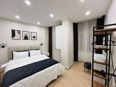 a bedroom with a bed and a bunk ladder at Westley Residence Taksim in Istanbul