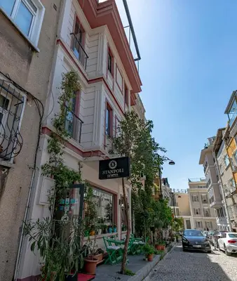 a building with a sign on the side of it at Stanpoli Hostel in Istanbul