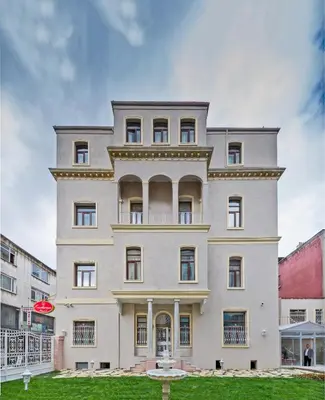 a large white building with at Enderun Hotel Istanbul in Istanbul