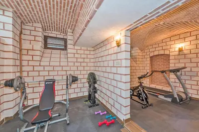 a room with a gym with two exercise bikes at Enderun Hotel Istanbul in Istanbul