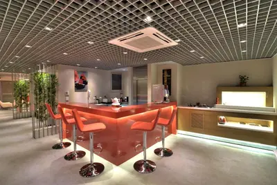 a kitchen with a red table and chairs in a room at Endless Suites Taksim in Istanbul