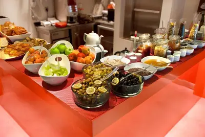 a table with many different types of food on it at Endless Suites Taksim in Istanbul
