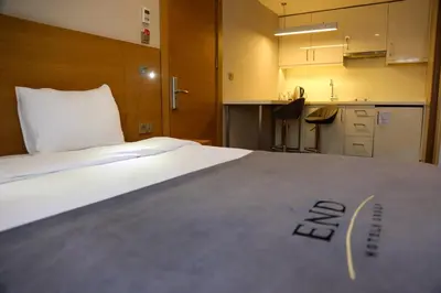 a large bed in a room with a kitchen at Endless Suites Taksim in Istanbul