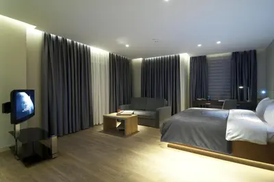 a hotel room with a bed and a television at Endless Suites Taksim in Istanbul