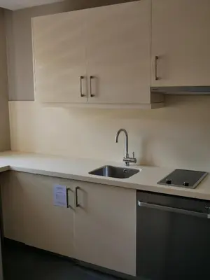 a kitchen with white cabinets and a sink at Endless Suites Taksim in Istanbul