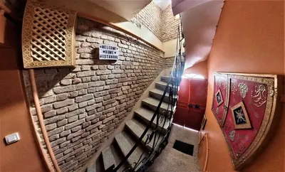 a spiral staircase in a building with a brick wall at Elele Aparts in Istanbul