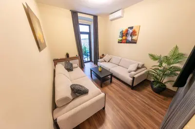 a living room with two couches and a window at ROYAL TAKSIM SUITES in Istanbul