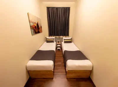 a row of beds in a room with a window at ROYAL TAKSIM SUITES in Istanbul