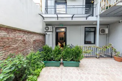 a house with two plants in front of a building at ROYAL TAKSIM SUITES in Istanbul