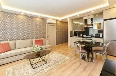 a living room with a couch and a table at All Seasons Suites in Istanbul