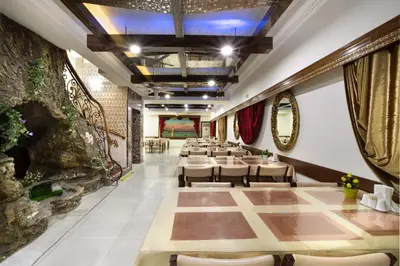 a long dining room with tables and chairs at Elan Hotel Istanbul Pera in Istanbul