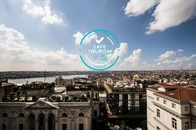 a view of a city with a sign that says safe tourism at Elan Hotel Istanbul Pera in Istanbul