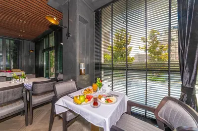 a dining room with a table with fruit on it at Opale Hotel in Istanbul