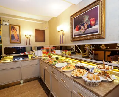 a buffet line with many different types of food at Elysion Hotel in Istanbul