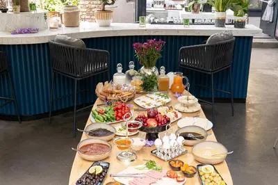 a table with food on it in a restaurant at Malta Bosphorus Hotel in Istanbul