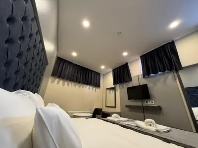 a hotel room with a bed and a mirror at Spinel Hotel - Old City in Istanbul
