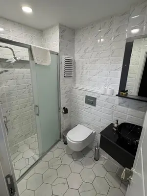 a bathroom with a toilet and a shower and a sink at Spinel Hotel - Old City in Istanbul