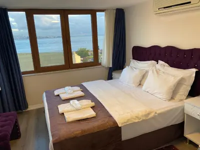 a bedroom with a bed with two towels on it at Spinel Hotel - Old City in Istanbul