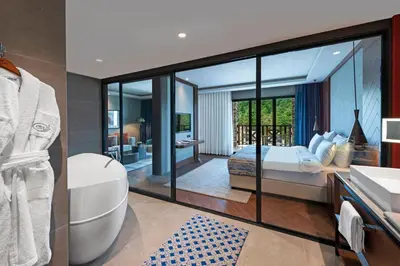 a bathroom with a bed and a tub and a sink at Elite World Grand Sapanca in Sapanca