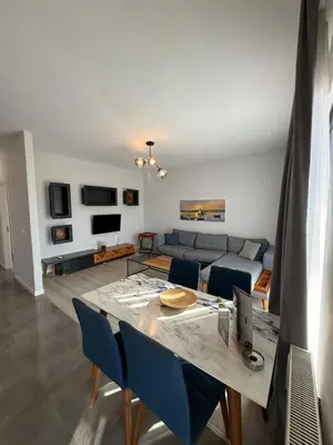 a living room with a couch and a table at Green Hills Suites in Yalova