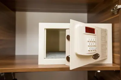 a white microwave on a wooden shelf in a room at Corner Garden Hotel in Istanbul