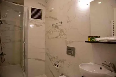 a bathroom with a shower and a sink at Nupelda Residence Hotel in Istanbul