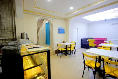 a dining room with tables and yellow chairs at Grand FM Hotel in Istanbul