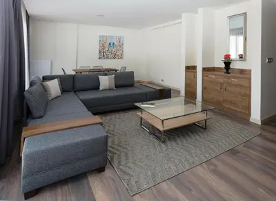 a living room with a couch and a coffee table at Princess Residence in Istanbul