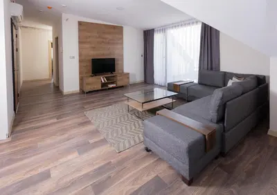 a living room with a couch and a tv at Princess Residence in Istanbul