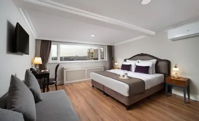 a hotel room with a bed and a window at Meroddi La Porta in Istanbul