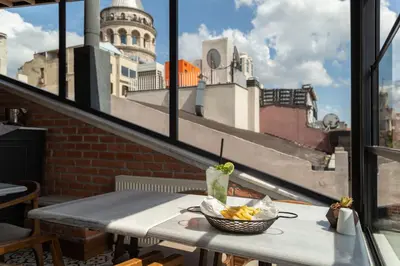 a bowl of fruit on a table on a balcony at Meroddi La Porta in Istanbul