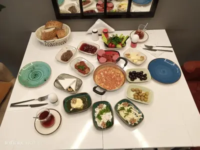 a table with plates of food on it at Tavra hotel in Istanbul