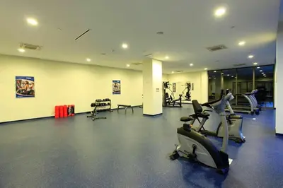 a gym with treadmills and exercise bikes in a room at CTS Taksim Elysium Residence Dublex D-84 in Istanbul